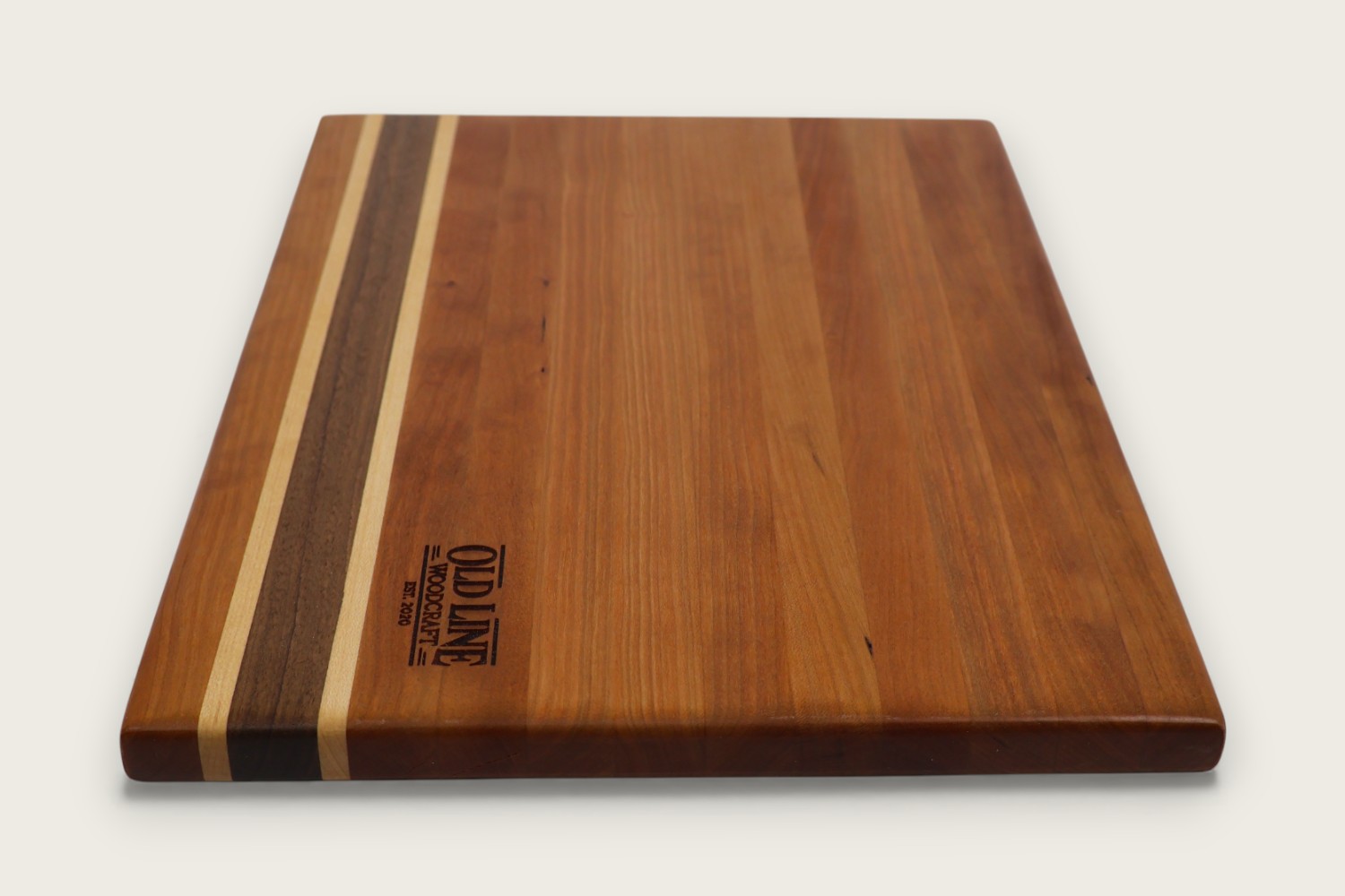 Cherry Hearthwood Serving Board (#235) with edge-grain cherry wood, horizontal pattern, and warm amber tones.